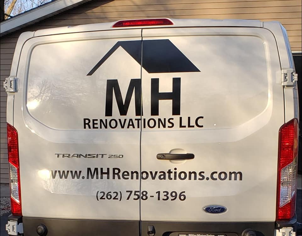 MH Renovations Van with contact information on van wrap
